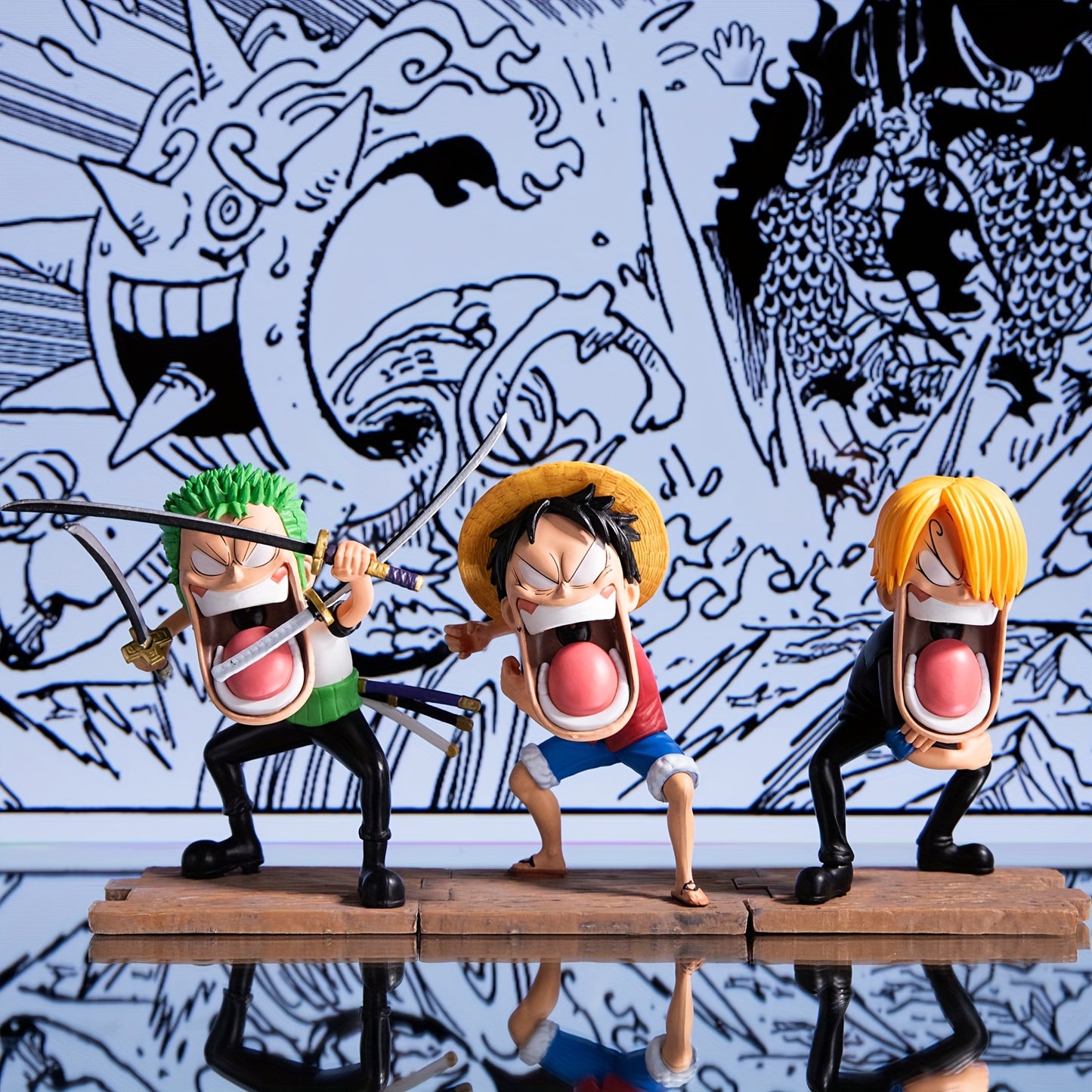 A set of 3 anime-related figurines, a three-person statue accessory,