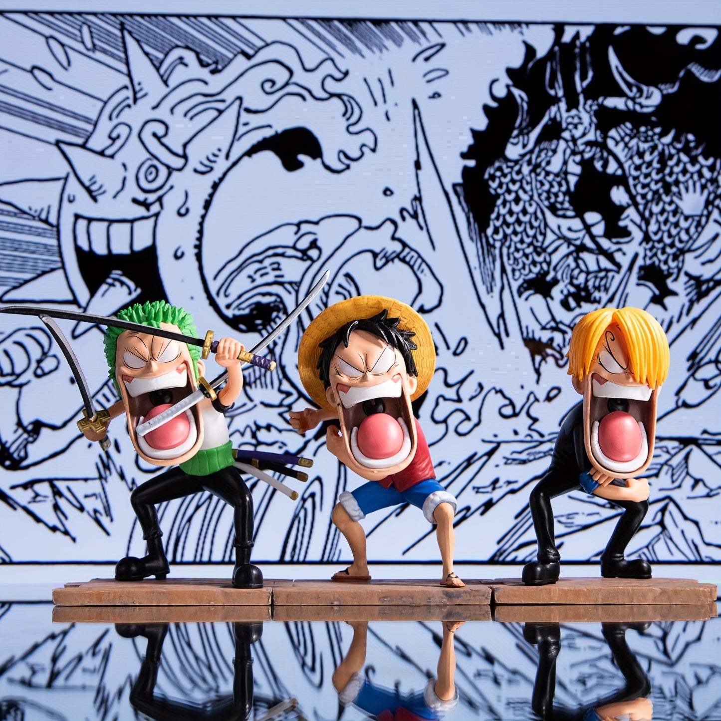 A set of 3 anime-related figurines, a three-person statue accessory,